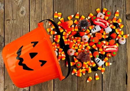 Candy corn spilling out of candy bucket