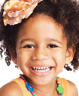 Smiling girl with beads